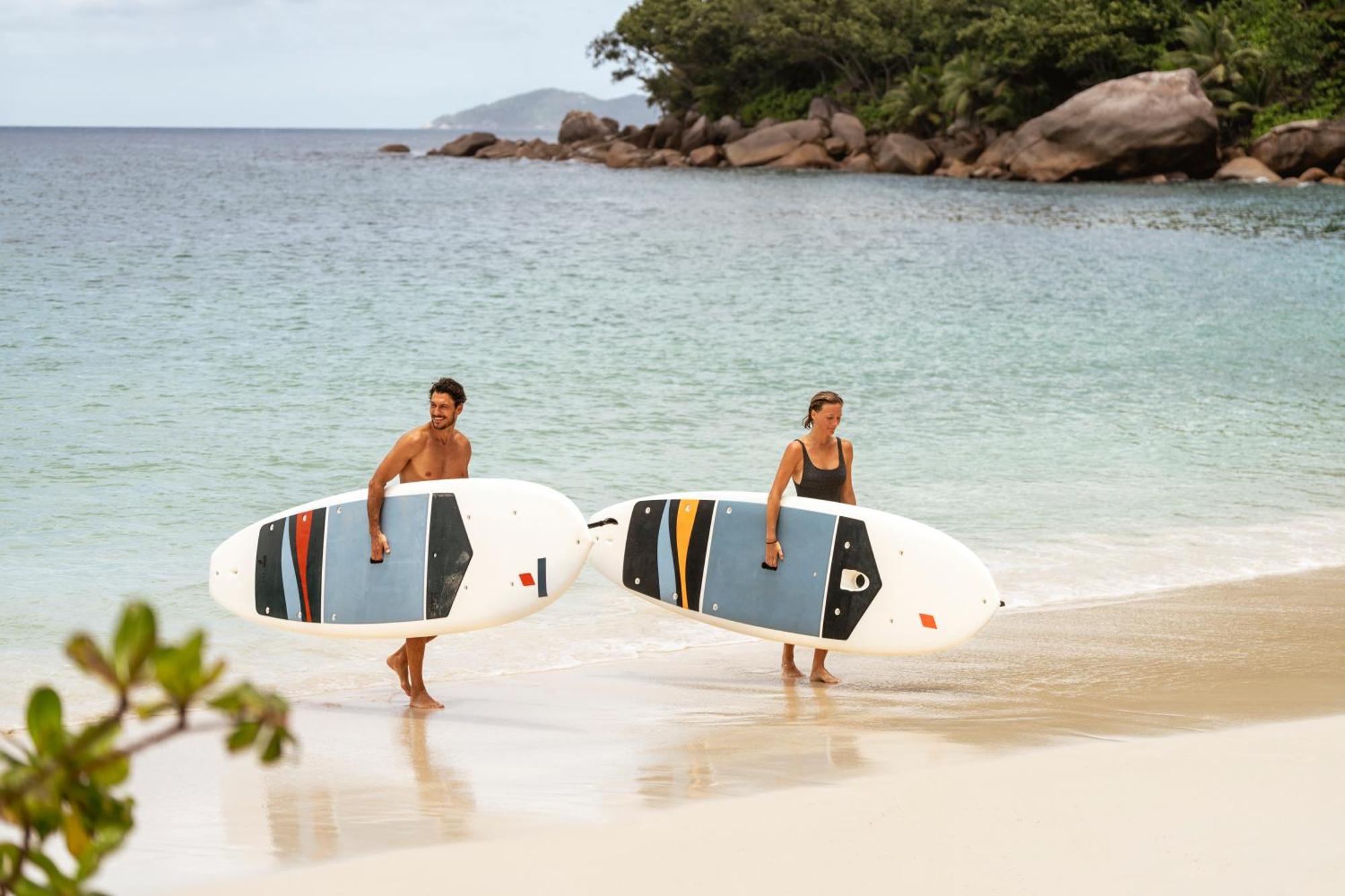 Constance Lemuria Grand Anse  Εξωτερικό φωτογραφία Stand up paddle boarders on a beach